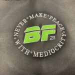 brand or team logo embroidered onto the fitness equipment upholstery