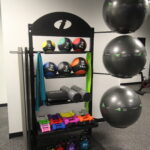 Custom Color and Custom Logo Multi-Storage Rack (MSR) is designed to fit the storage needs at your specific facility. With personalized logos and colors of your choice, our MSR is a fully customizable storage solution that is perfect for highlighting and organizing all your essential fitness accessories. With its small footprint and attractive design, our MSR is the answer to scattered accessories and bland, generic racks. Fill the trays with dumbbells, kettlebells, stability balls, medicine balls, foam rollers, yoga mats, strength bands, and so much more. This custom made IFS Multi-Storage Rack has a space for each fitness accessory. CUSTOM COLOR and LASER CUT CUSTOM LOGO included.Lofts at Riverwalk surpasses every expectation. Picture character, style, and an exceptional living experience property management of exceptional mutli-