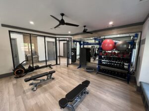 Multi-family Apartment Home Fitness Center Design and Installation Treadmill, Cardio Equipment and Strength with Custom Color, Treadmill, Elliptical, Dumbbells, and Dumbbell Rack. TRUE Fitness exceptional commercial fitness equipment. Unique Fitness Pieces, ready for what's new in fitness, custom functional training rigs with storage and virtual fitness, and Athletic Flooring Installation.