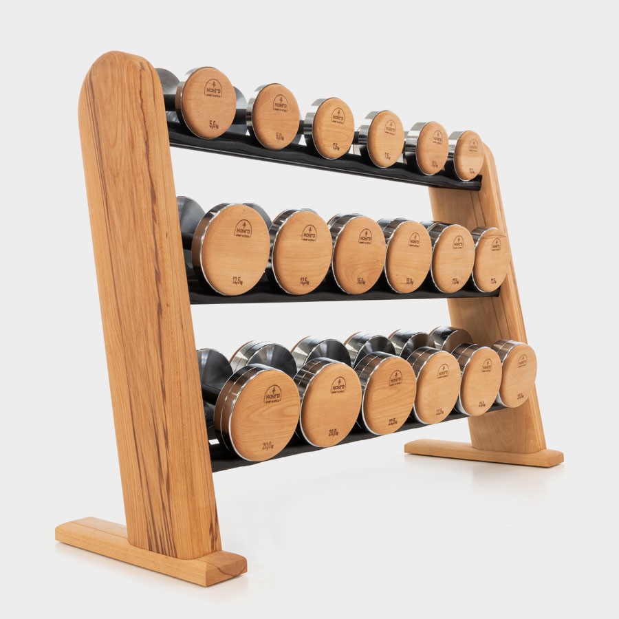 NOHRD DumbBells come paired with our space-saving, solid wood storage rack, sure to become a focal point in any gym space. The DumbBell diameters remain uniform across weight ranges, ensuring a streamlined look and seamless weight transitions. The angled wood frame is designed for maximized stability and organized convenience for your strength training session.