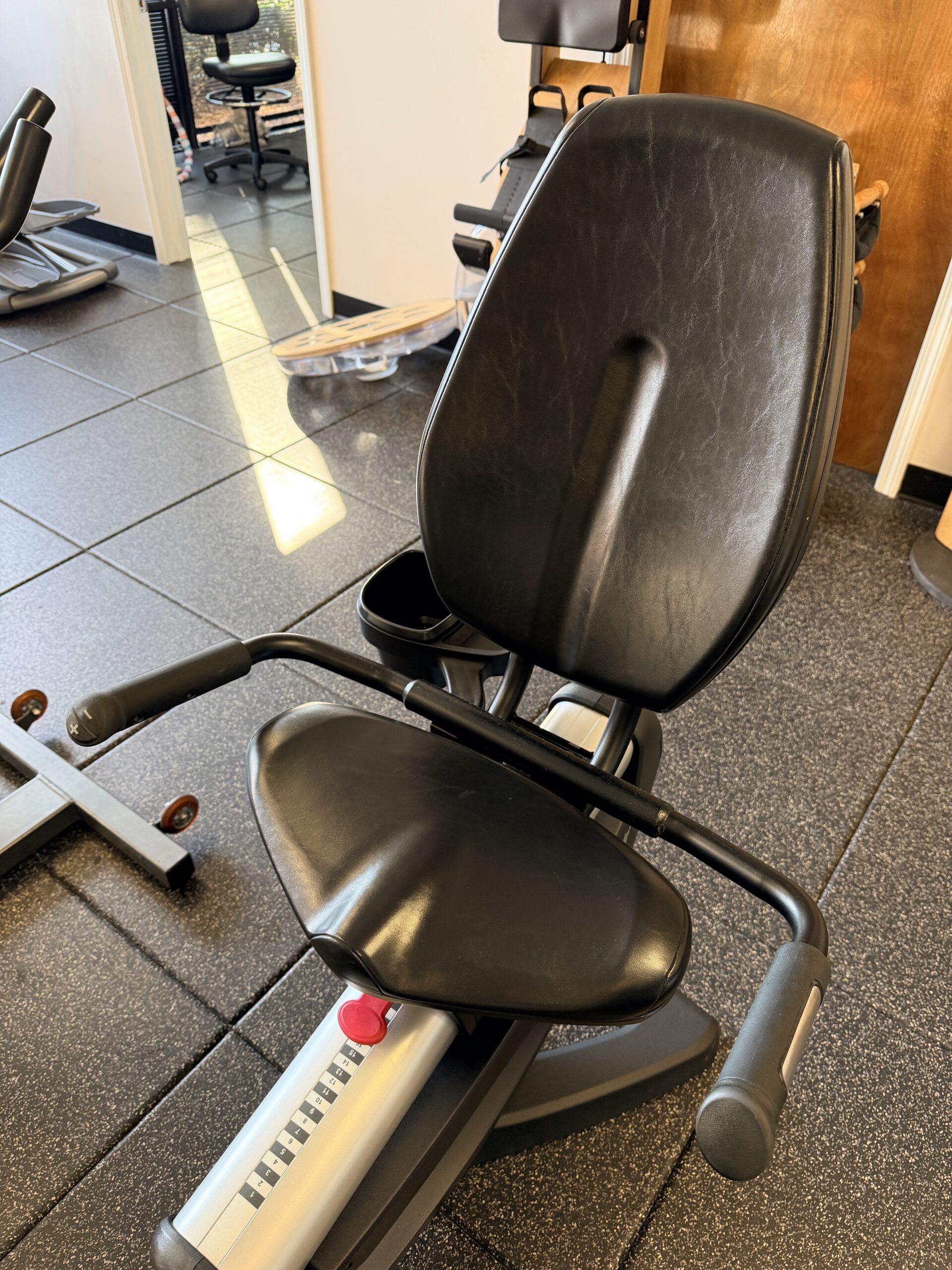 Commercial-grade Life Fitness 95RS recumbent fitness bike with touchscreen console for low-impact cardio workouts at Innovative Fitness in Georgia.