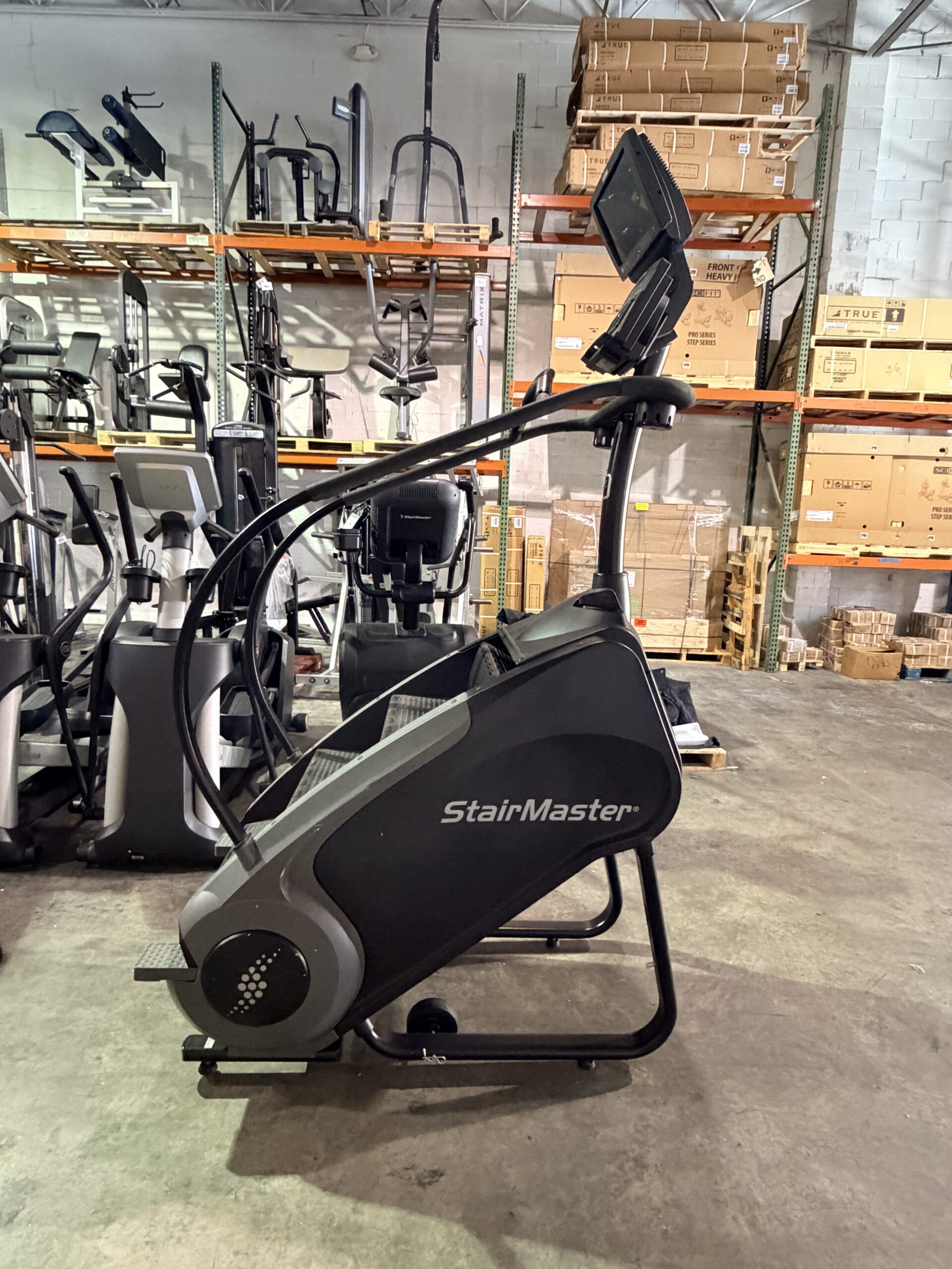 StairMaster Gauntlet Stepmill with LCD D-1 Console and integrated TV screen available for sale at Innovative Fitness in Kennesaw, Georgia, featuring commercial-grade stair climbing performance.