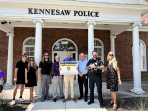 Representatives of the Chris Conti Memorial Grant, Innovative Fitness, and the Kennesaw Police Department gather to celebrate the opening of the department’s new fitness facility, made possible through the 2026 Chris Conti Memorial Grant and the generosity of its partners.