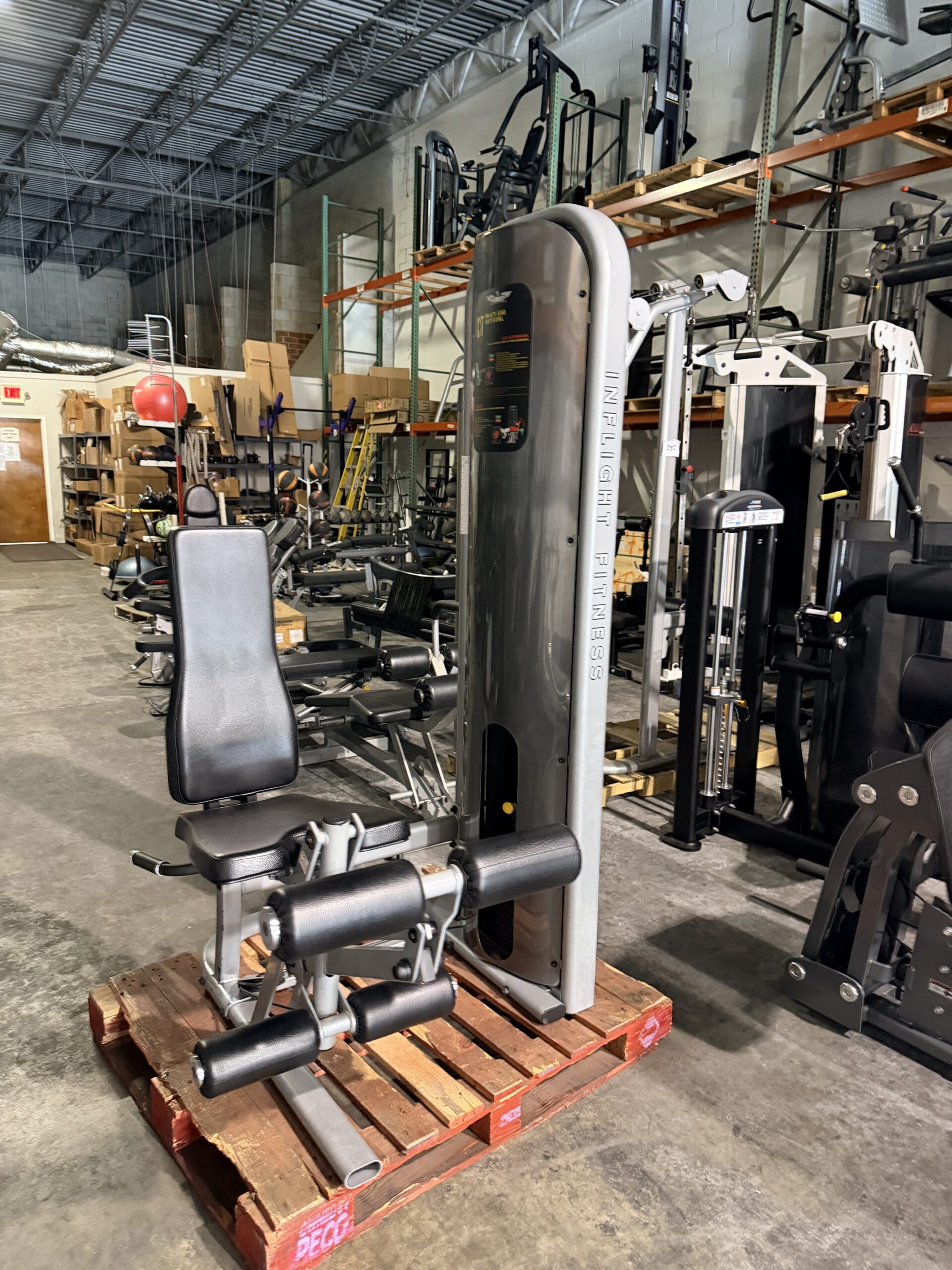 Inflight Fitness Multi Leg Extension and Leg Curl machine at Innovative Fitness in Kennesaw, GA, for commercial gym strength training.